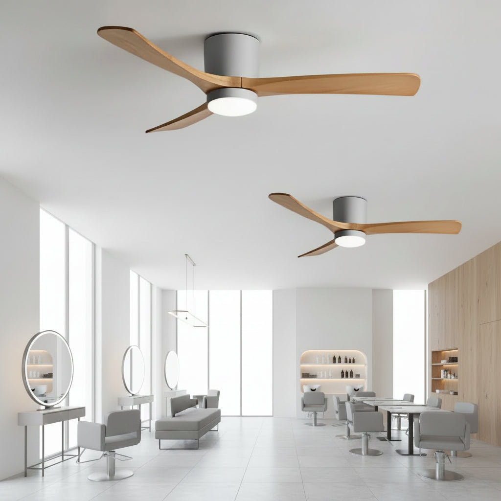 Modern ceiling fans in a stylish interior setting with tables and chairs.